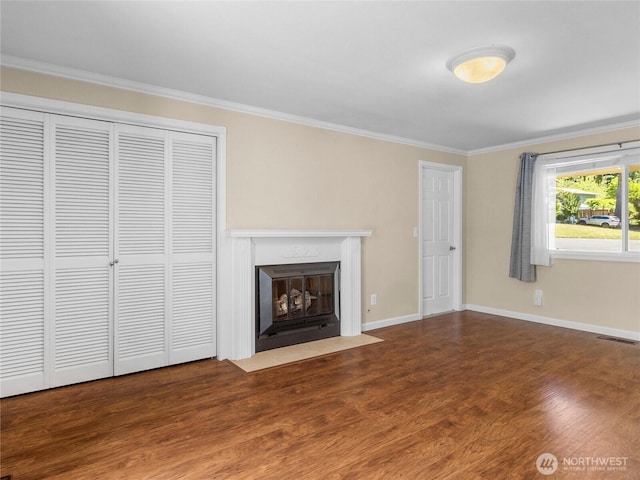 3929 Westpark Ct NW, Olympia, WA 98502 - unfurnished living room featuring ornamental molding, wood finished floors, and a fireplace with flush hearth