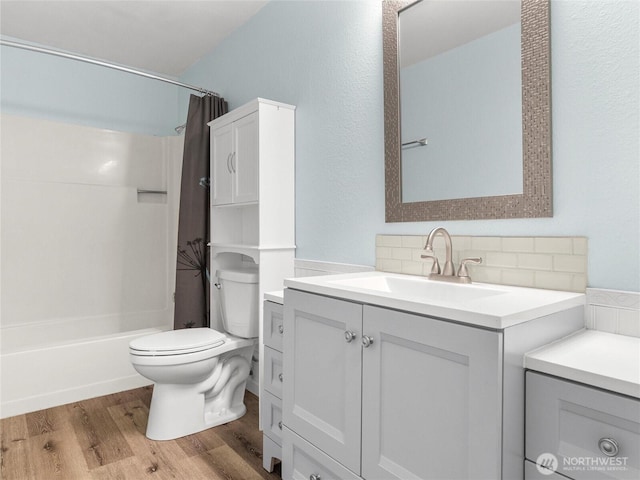 3929 Westpark Ct NW, Olympia, WA 98502 - bathroom with vanity, wood finished floors, decorative backsplash, and shower / tub combo with curtain