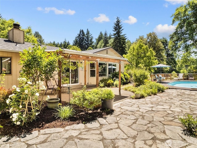 3929 Westpark Ct NW, Olympia, WA 98502 - back of property featuring a patio area, a chimney, and board and batten siding