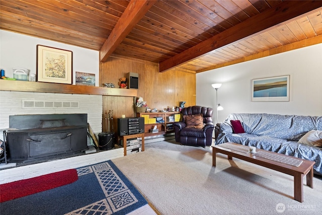 324 Mizzen Ave NW, Ocean Shores, WA 98569 - carpeted living area featuring a wooden ceiling with exposed beams and wooden walls