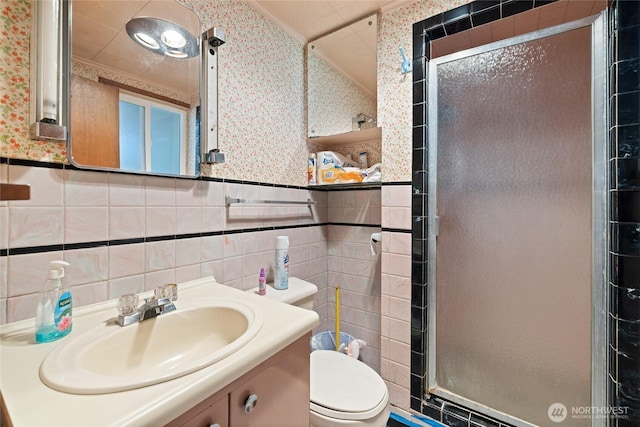 324 Mizzen Ave NW, Ocean Shores, WA 98569 - full bathroom featuring wallpapered walls, tile walls, a stall shower, vanity, and wainscoting