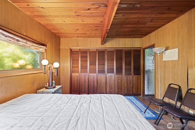324 Mizzen Ave NW, Ocean Shores, WA 98569 - bedroom with a wooden ceiling with exposed beams and wood walls