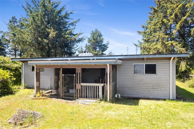 324 Mizzen Ave NW, Ocean Shores, WA 98569 - back of house featuring an outdoor structure