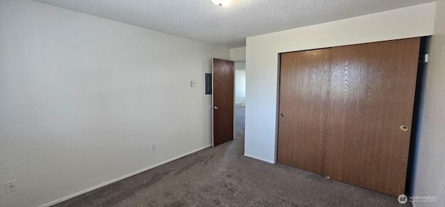 312 Charwila Ln, Enumclaw, WA 98022 - unfurnished bedroom with carpet flooring, a closet, and a textured ceiling