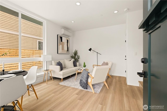 1525 N 39th St, Seattle, WA 98103 - living area with recessed lighting, a wall unit AC, and light wood-style flooring