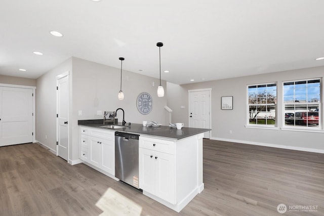 314 4th Ave S, Algona, WA 98001 - kitchen with stainless steel dishwasher, dark countertops, light wood-style floors, and recessed lighting