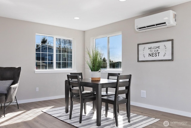 314 4th Ave S, Algona, WA 98001 - dining space with a wall unit AC, wood finished floors, and recessed lighting