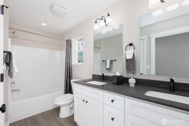 314 4th Ave S, Algona, WA 98001 - bathroom featuring shower / tub combo with curtain, double vanity, wood finished floors, and recessed lighting
