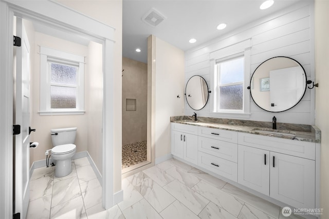 821 S Mary Ave, East Wenatchee, WA 98802 - full bath with marble look tile flooring, double vanity, a shower stall, and recessed lighting