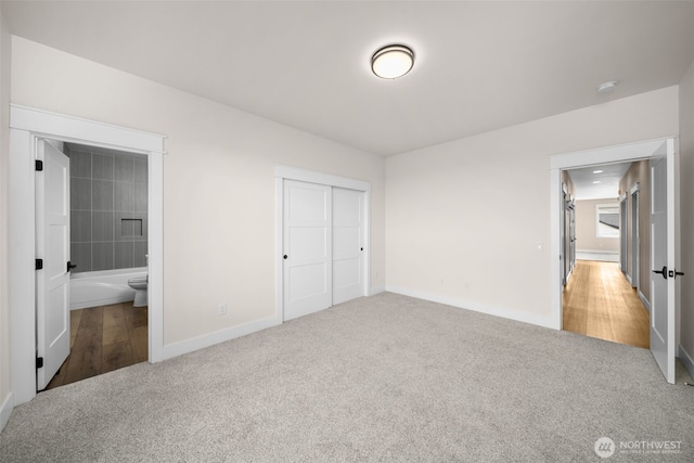 821 S Mary Ave, East Wenatchee, WA 98802 - unfurnished bedroom featuring carpet, a closet, and ensuite bathroom