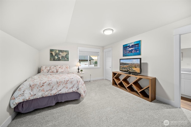 821 S Mary Ave, East Wenatchee, WA 98802 - bedroom featuring light colored carpet, lofted ceiling, and ensuite bath