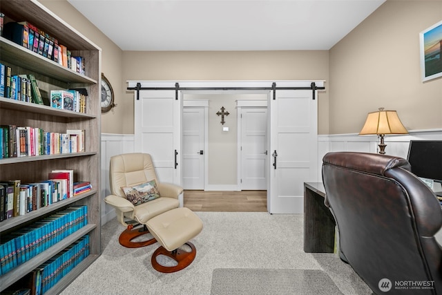 821 S Mary Ave, East Wenatchee, WA 98802 - office area with a barn door, wainscoting, and carpet flooring