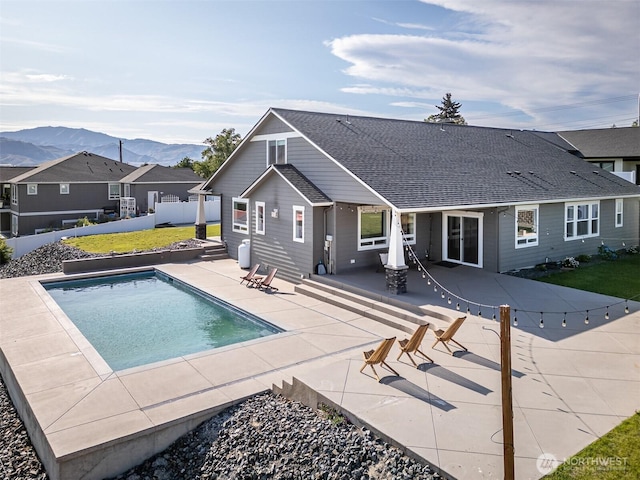 821 S Mary Ave, East Wenatchee, WA 98802 - rear view of house featuring a fenced backyard, a mountain view, a patio, and an outdoor pool