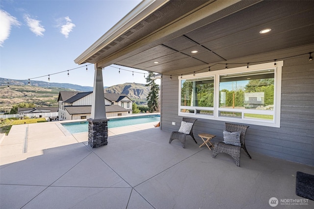 821 S Mary Ave, East Wenatchee, WA 98802 - view of patio featuring a mountain view and an outdoor pool