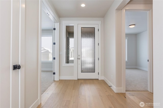 11413 Interlaaken Dr SW, Lakewood, WA 98498 - foyer featuring light wood-style flooring and healthy amount of natural light