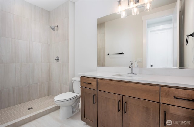 11413 Interlaaken Dr SW, Lakewood, WA 98498 - bathroom featuring vanity, a tile shower, and tile patterned flooring
