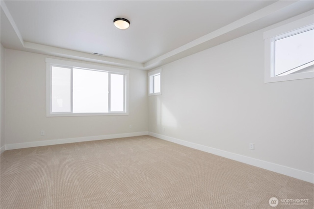11413 Interlaaken Dr SW, Lakewood, WA 98498 - unfurnished room featuring light colored carpet and a raised ceiling