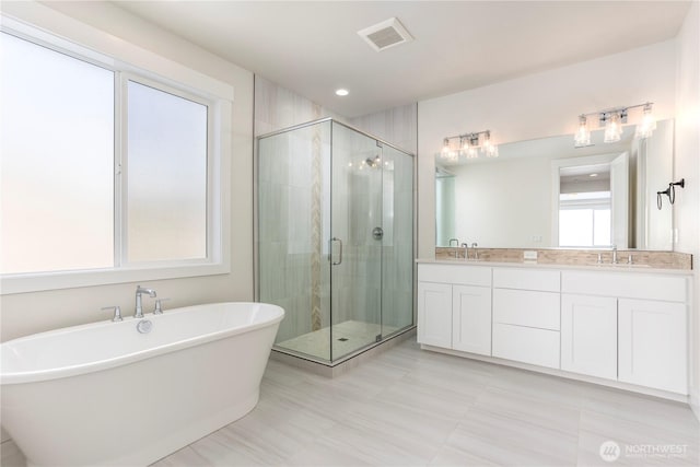 11413 Interlaaken Dr SW, Lakewood, WA 98498 - bathroom with double vanity, a soaking tub, and a shower stall