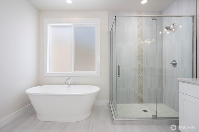 11413 Interlaaken Dr SW, Lakewood, WA 98498 - full bath featuring a freestanding tub, a stall shower, vanity, and recessed lighting