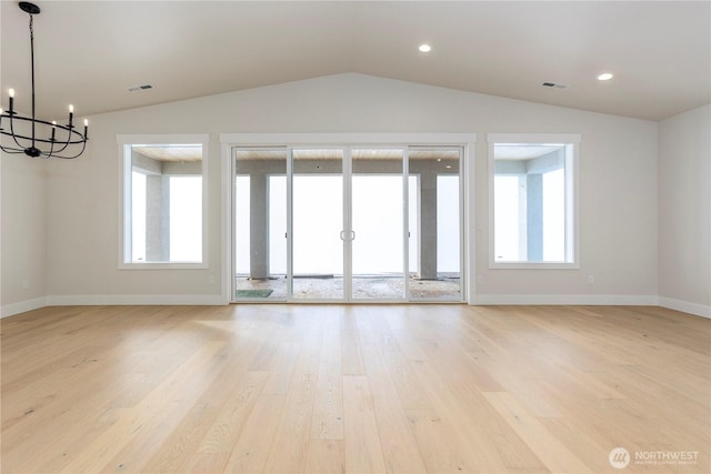 11413 Interlaaken Dr SW, Lakewood, WA 98498 - empty room featuring lofted ceiling, a chandelier, light wood-style floors, plenty of natural light, and recessed lighting