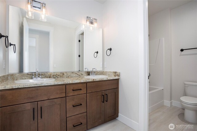 11413 Interlaaken Dr SW, Lakewood, WA 98498 - full bathroom with double vanity and bathtub / shower combination