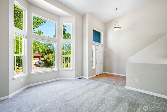 3218 127th Ave NE, Lake Stevens, WA 98258 - carpeted foyer entrance featuring a high ceiling and baseboards