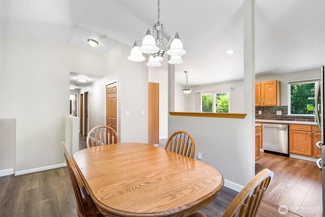3218 127th Ave NE, Lake Stevens, WA 98258 - dining space with dark wood-style floors, a chandelier, recessed lighting, and vaulted ceiling