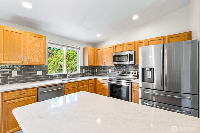 3218 127th Ave NE, Lake Stevens, WA 98258 - kitchen featuring appliances with stainless steel finishes, light countertops, decorative backsplash, vaulted ceiling, and recessed lighting