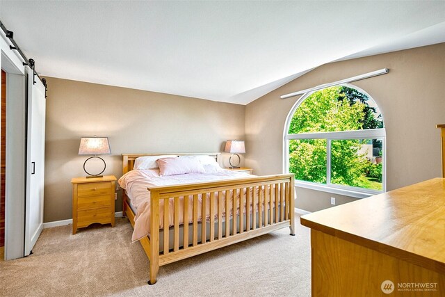 3218 127th Ave NE, Lake Stevens, WA 98258 - carpeted bedroom with a barn door and vaulted ceiling