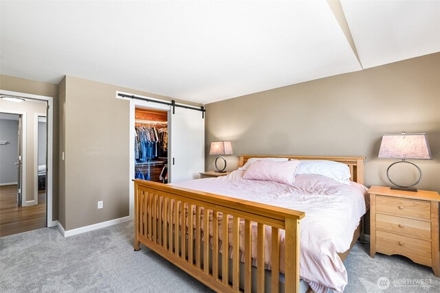 3218 127th Ave NE, Lake Stevens, WA 98258 - bedroom with a barn door, carpet, a closet, and a walk in closet