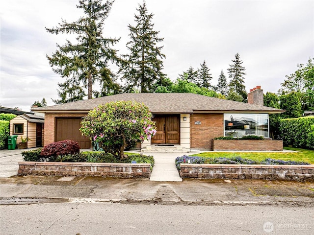 1709 NW 99th St, Seattle, WA 98117 - single story home featuring a chimney, a garage, brick siding, and a shingled roof
