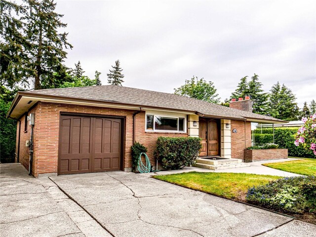 1709 NW 99th St, Seattle, WA 98117 - single story home with an attached garage, a chimney, driveway, and brick siding