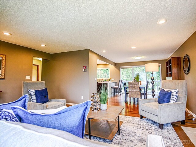 1709 NW 99th St, Seattle, WA 98117 - living room with a textured ceiling, wood finished floors, recessed lighting, and baseboards