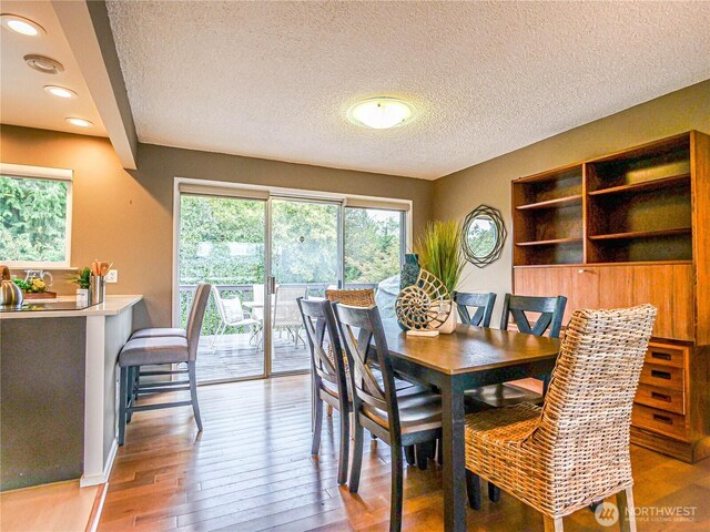 1709 NW 99th St, Seattle, WA 98117 - dining area featuring light wood-type flooring, recessed lighting, and a textured ceiling