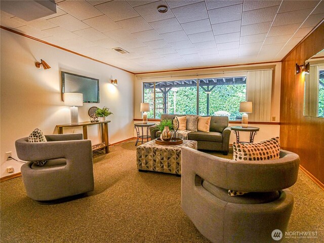 1709 NW 99th St, Seattle, WA 98117 - living room featuring carpet floors, healthy amount of natural light, crown molding, wood walls, and baseboards