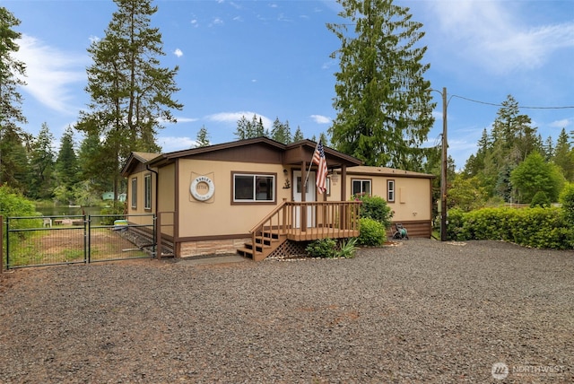 1171 E Trails End Dr, Belfair, WA 98528 - manufactured / mobile home featuring a gate
