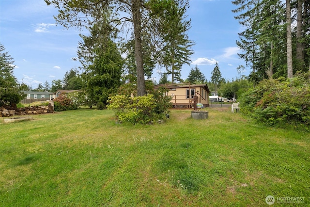 1171 E Trails End Dr, Belfair, WA 98528 - view of grassy yard with a deck