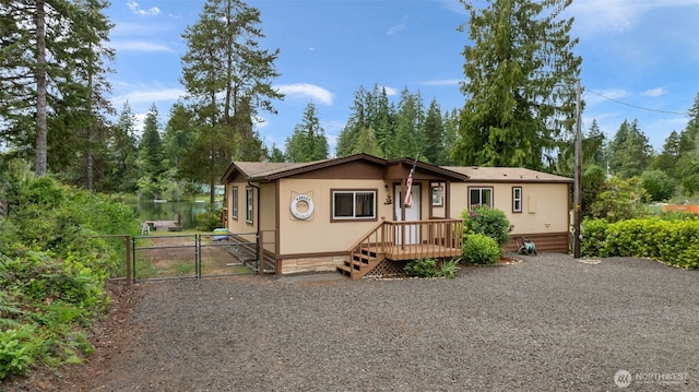 1171 E Trails End Dr, Belfair, WA 98528 - view of front of property featuring a gate and view of wooded area