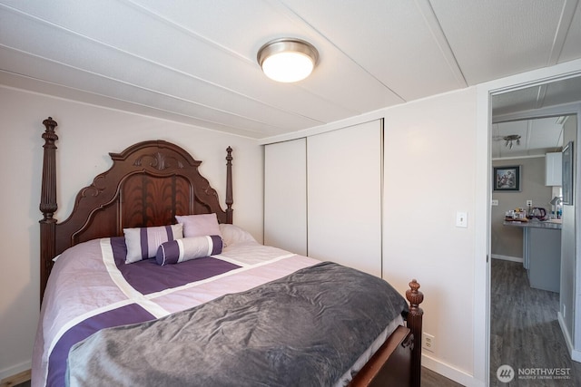 2240 W Broadway Ave Unit 25, Moses Lake, WA 98837 - bedroom with wood finished floors, a closet, and baseboards
