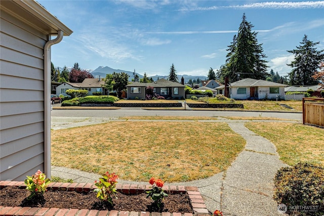 1415 E 2nd St, Port Angeles, WA 98362 - view of grassy yard with a residential view and a mountain view
