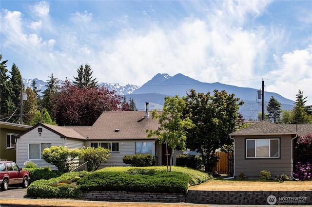 1415 E 2nd St, Port Angeles, WA 98362 - view of front of house with a mountain view and roof with shingles