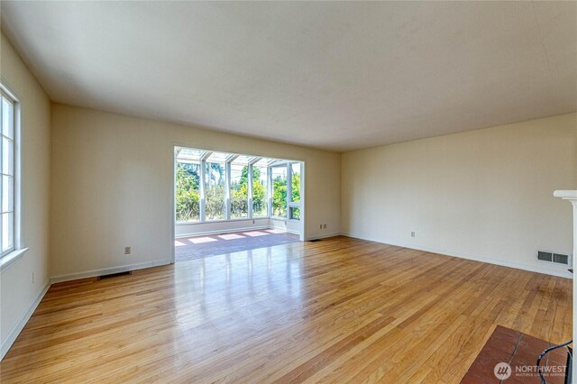 1415 E 2nd St, Port Angeles, WA 98362 - unfurnished room with healthy amount of natural light and light wood-type flooring