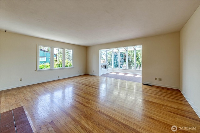 1415 E 2nd St, Port Angeles, WA 98362 - empty room with light wood finished floors and baseboards