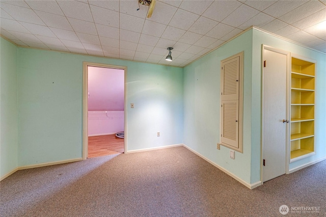 1415 E 2nd St, Port Angeles, WA 98362 - carpeted empty room featuring baseboards