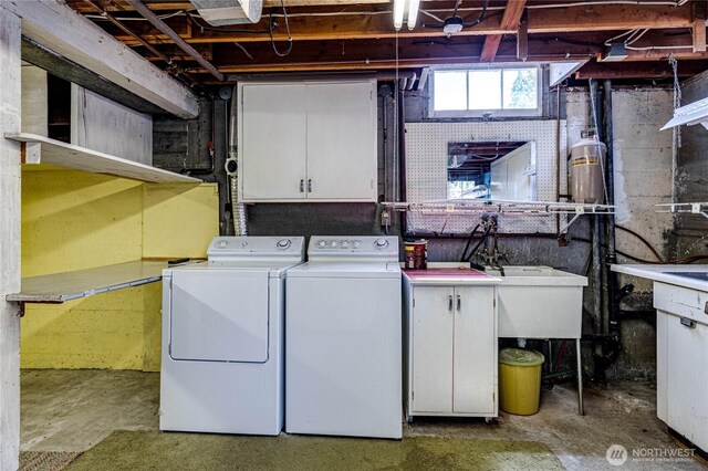 1415 E 2nd St, Port Angeles, WA 98362 - washroom with cabinet space and washing machine and clothes dryer