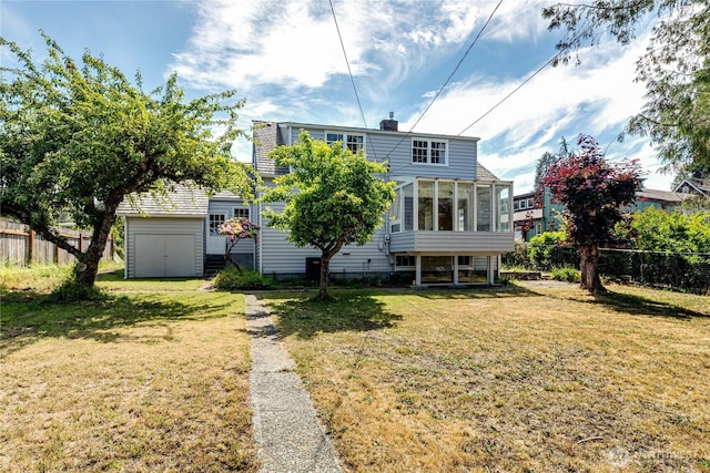 1415 E 2nd St, Port Angeles, WA 98362 - rear view of house with a sunroom, a shed, and a chimney