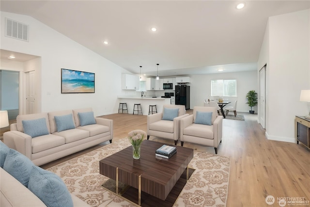 24 Hurd Rd, Elma, WA 98541 - living area with light wood finished floors, lofted ceiling, and recessed lighting