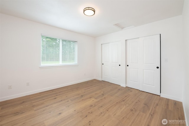 24 Hurd Rd, Elma, WA 98541 - unfurnished bedroom with attic access and light wood-style flooring