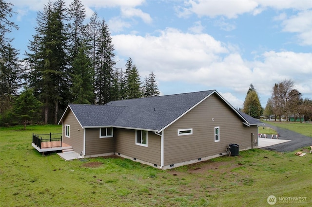 24 Hurd Rd, Elma, WA 98541 - back of house with a deck, a shingled roof, and a lawn
