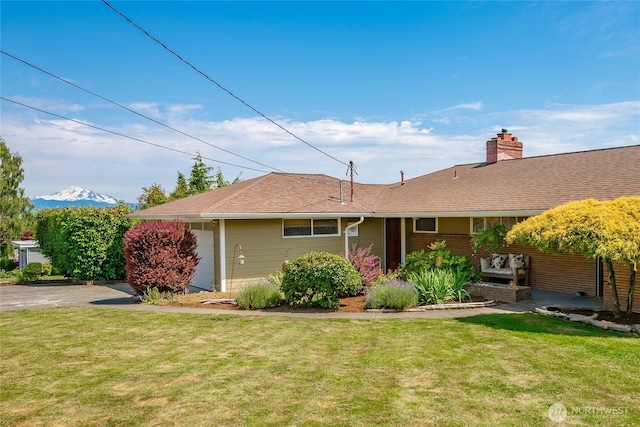2483 Hilltop Rd, Ferndale, WA 98248 - back of property featuring a yard and a chimney